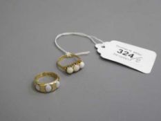 An antique 18ct gold opal set ring,