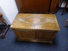 A carved oak blanket box