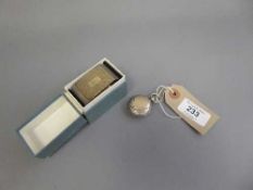 A silver sovereign case together with a silver napkin ring.