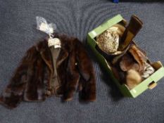 A lady's fur coat retailed by Fenwick's French Salon and a box of fur hats, gloves,