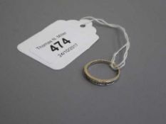 An 18ct gold diamond half eternity ring