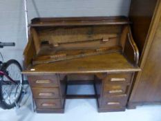 An oak roll top desk