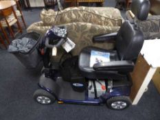 A Electro Motion Super Glide disability cart with keys, charger,