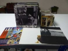 A case containing LP's including Susie and the Banshees, Gary Newman etc,