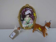 A Beswick figure of a terrier together with a Royal Doulton figure of a Corgi a Wedgwood