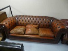 A re-upholstery project - a tan leather three seater Chesterfield