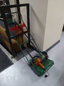 A Qualcast lawn raker,