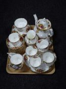 Thirty-four pieces of Royal Albert Old Country Roses tea china and matching vase and pot