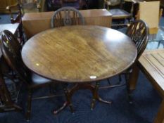A Victorian mahogany tilt top table on three way pedestal