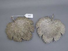A pair of continental white metal leaf dishes with engraved decoration, 438.3g.