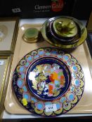 Three decorative German wall plates and four pottery shallow dishes and bowls