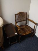 A carved oak stool and a walnut bergere bedroom chair
