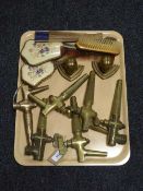 Six brass taps, pair of brass Native American heads,