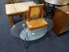 A glass two tier coffee table and a pine dressing table mirror