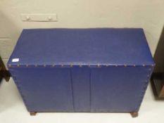 A pine and leather upholstered blanket box