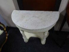 A painted d-shaped hall table with marble top