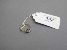 An 18ct gold three stone diamond crossover ring