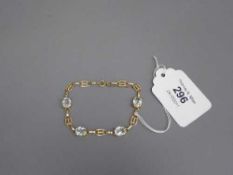 A yellow gold bracelet set with four aquamarines, 8.3g.