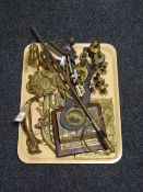 A large quantity of brassware including miniature candlesticks, horse brasses, corkscrew,