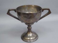 A silver twin handled trophy cup, 674.3g.