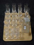 A tray containing a set of eight wine glasses with six matching champagne flutes,