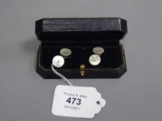 A pair of gold and diamond set mother of pearl cufflinks