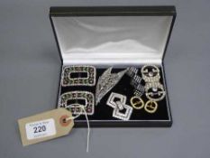 A pair of Art Deco French paste buckles, together with six further early twentieth century brooches,