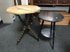 A plant table and a shaped painted occasional table
