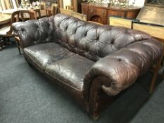 A brown button leather Chesterfield settee