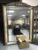 An ornate gilt framed Victorian style bevelled mirror