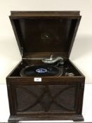An early 20th century oak table top HMV gramophone,