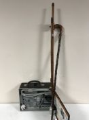 A cased Videotronic 8mm projector, two piece split cane rod and reel,