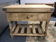 A pine butcher's block fitted with a drawer,