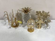 A Swarovski crystal pineapple and four Swarovski crystal ornaments with glass drops