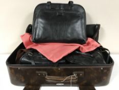 A suitcase of lady's hand bags - Radley, etc,