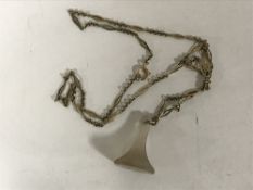 An antique agate seal fob suspended upon a gold chain