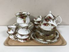 A tray containing a twenty-two piece Royal Albert Old Country Roses tea service together with eight