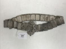 An ornate Eastern white metal belt