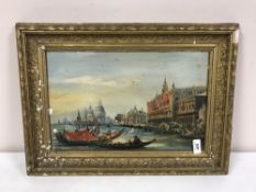 An early 20th Century gilt-framed oil painting depicting Venice.
