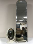 A mid 20th century cheval mirror on three way stand and an oval dressing table mirror