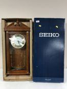 A Seiko Whittington and Westminster chiming wall clock, boxed.