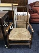 An elm rush seated armchair