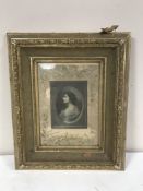 Two monochrome photographs in ornate gilt frames.