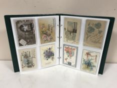 An album of old greetings cards and postcards
