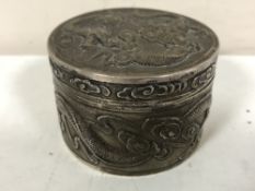 A Chinese silver lidded pot, maker Wang Hing, with embossed dragon decoration, diameter 6.