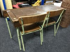 A mid 20th century double school desk and chairs