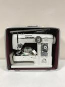 A cased Janome sewing machine