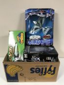 A box of three remote controlled toys and a rubber band powered glider