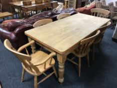 A pine farmhouse kitchen table and six chairs