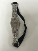 Superb quality Lady's platinum cocktail watch set with approximately 2.